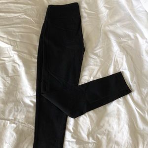 TNA black stride leggings size small